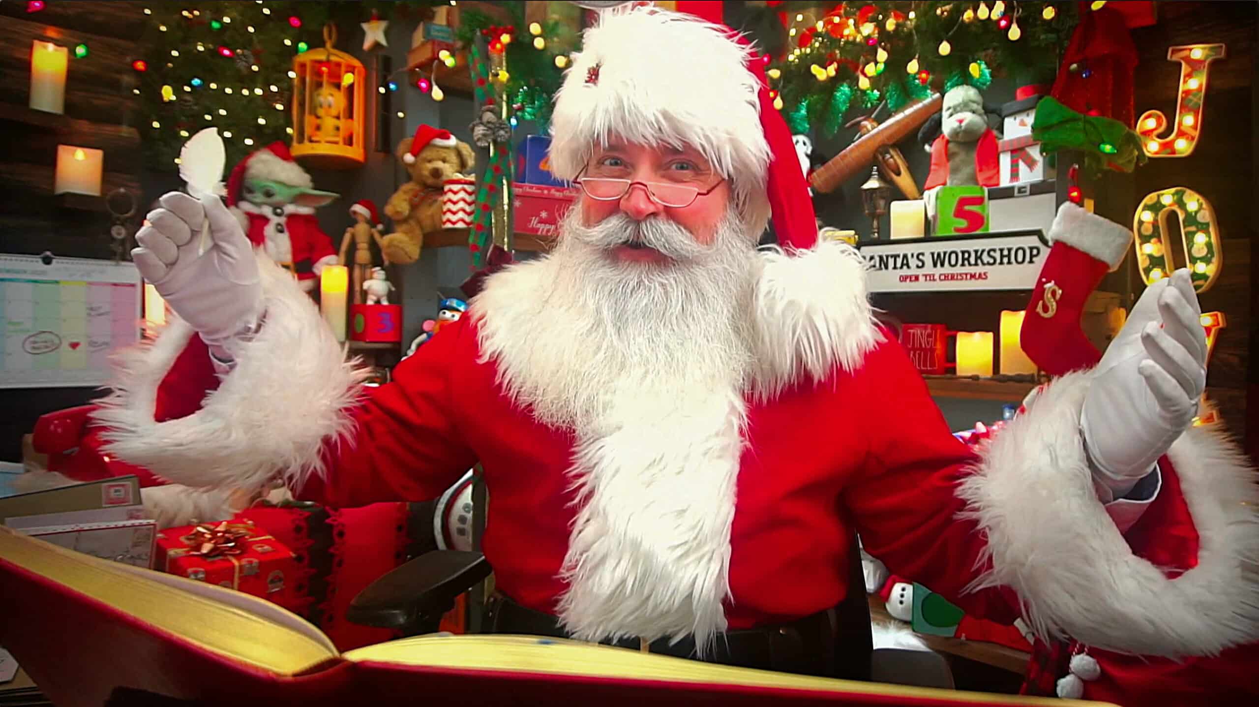 Santa sitting in his North Pole Workshop